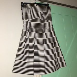 A black and whit stripped strapless dress